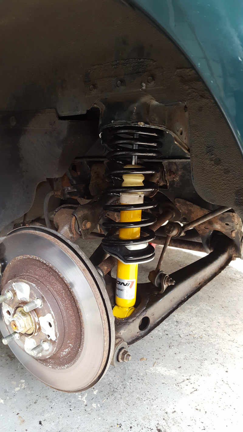 New parts from Flyin’ Miata (spring, shock, bumpstop), installed on the left rear